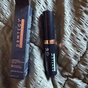 DRMTLGY Luminous Eye Corrector SPF 45 - Black and Gold